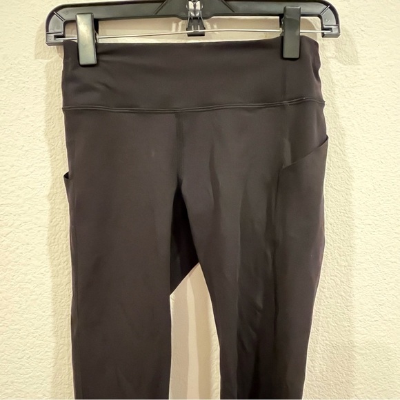 Lululemon black leggings size 4 with side leg pockets back pocket and panels - Picture 5 of 13